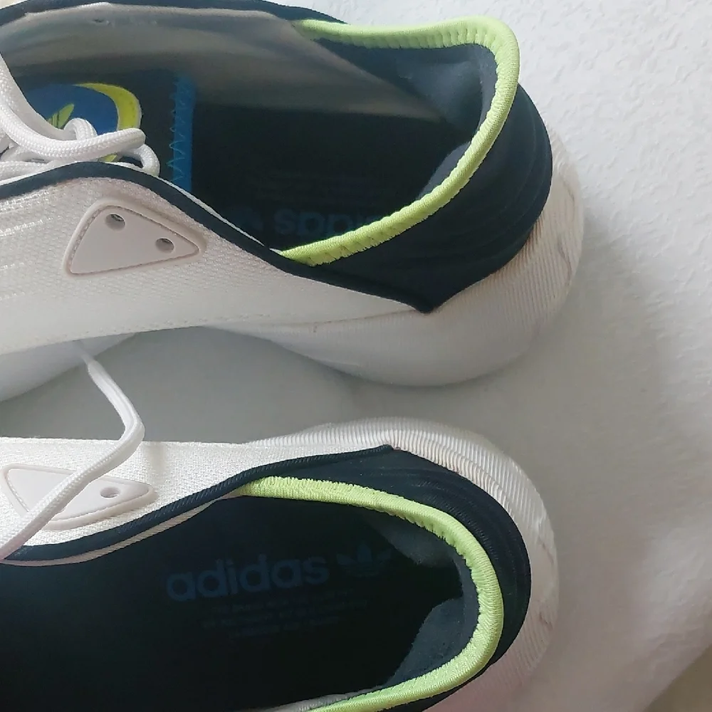 Adidas Adifom SLTN shoes in the Cloud White / SolarYellow / Blue Colorway